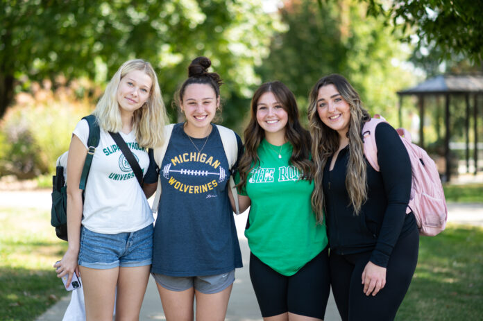 A group of freshman friends gather in the quad during common hour. Most freshman and transfers moved into their dorms on August 22