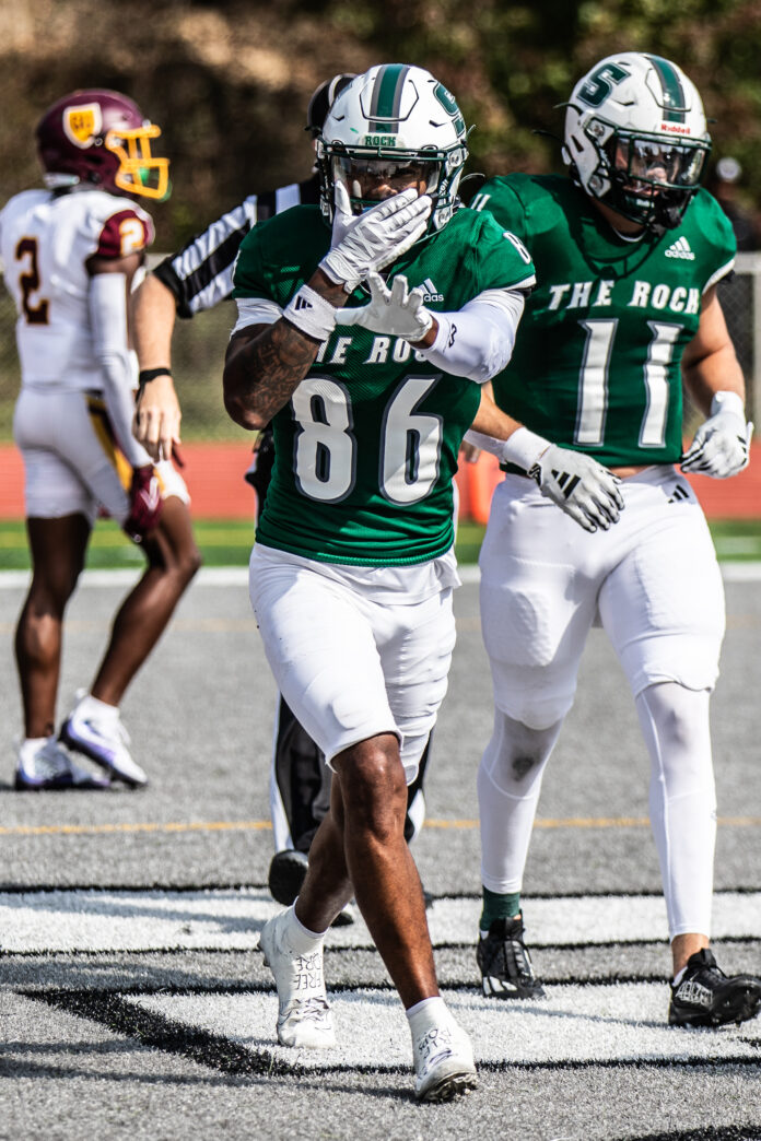 Mike Soloman celebrates in the end zone during a 35-17 win over Gannon University on Oct. 12. The receiver brought in a touchdown during the home game. Eddie Clancy / The Rocket